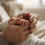 Parent holding a newborn's hand, representing a birth injury claim in Ontario